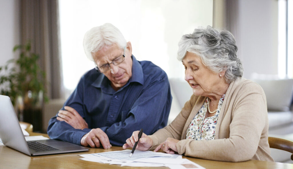 Couple writing a wills & estate plan